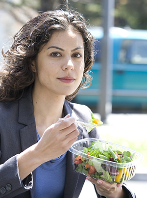 Woman eating salad