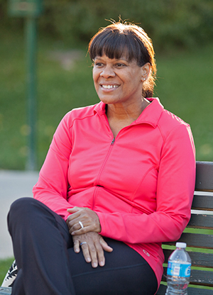 Woman sitting on park bench.