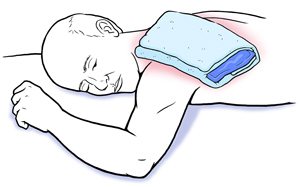 Man lying face down with ice pack on shoulder.