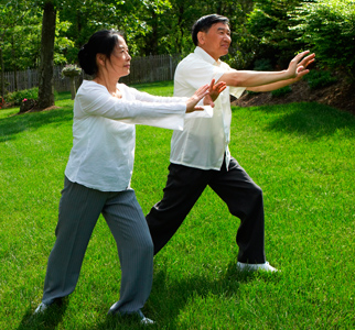 Woman and man doing tai chi